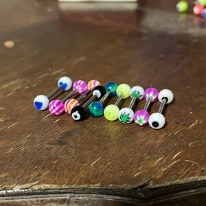 9 multicolor tounge piercings.